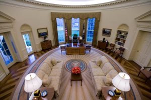 An intererior view of the Oval Office at the White House, empty of people during the George W Bush Administration. The Oval Office is the official office of the President of the United States. Located in the West Wing of the White House, the elliptical-shaped office features three large south-facing windows behind the president's desk and a fireplace at the north end of the room. Photo by Brooks Kraft/Corbis